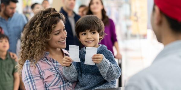 Mom and son with tickets