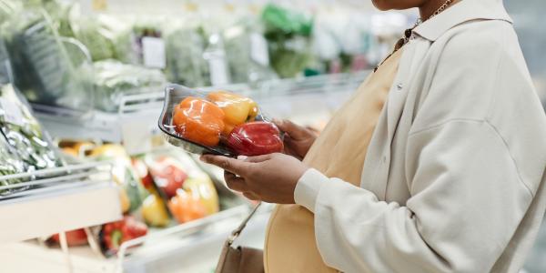 Expectant mom grocery shopping